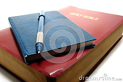 Bible, notebook and pen Stock Photo