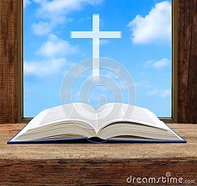 Bible open christian cross light sky view Stock Photo