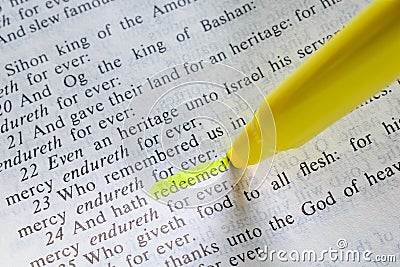 Bible passage with `redeemed` highlighted Stock Photo