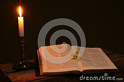 Bible prayer book candle Stock Photo