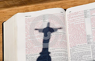 Bible with red letters & shadow of Jesus Christ Stock Photo