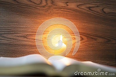 Bible under candlelight and christian holy inspiration concept Stock Photo