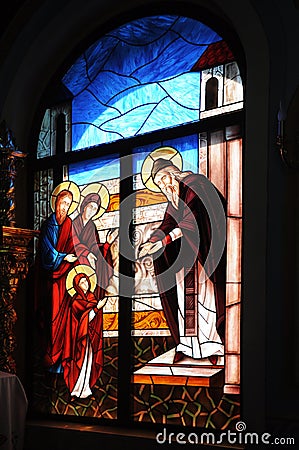 Biblical motif depicted on the window of the church in the techn Stock Photo