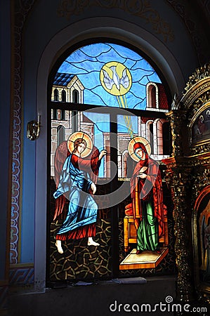 Biblical motif depicted on the window of the church in the techn Stock Photo