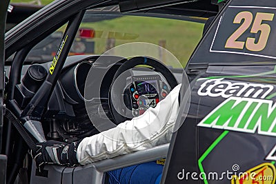 Driver hand and driving wheel of an AlpineA110 Editorial Stock Photo