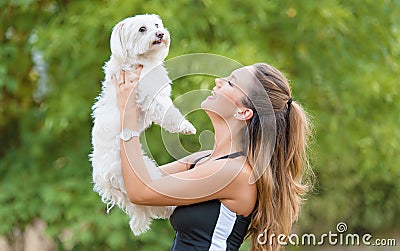 Bichon bolognese dog with beautiful in the park Stock Photo