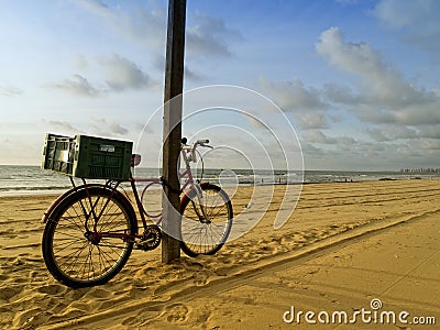 Classic bike in Recife beach, Brazil Stock Photo