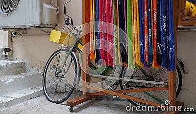 bicycle behind colorful handkerchiefs, Nafplio, Greece Stock Photo