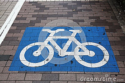 Bicycle crossing painted in blue and white Stock Photo