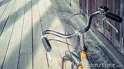 Bicycle handle bar close up on wooden floor background Stock Photo