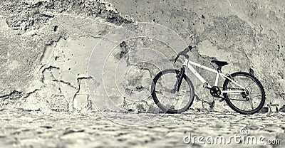 Bicycle near a stone wall Stock Photo