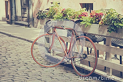 Bicycle on old street. Vintage styled. Stock Photo