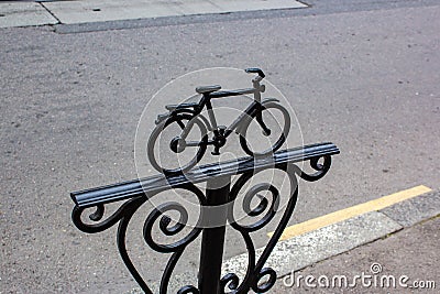 Bicycle Parking sign made of metal painted black on a city street. Metal bicycle sculpture Editorial Stock Photo