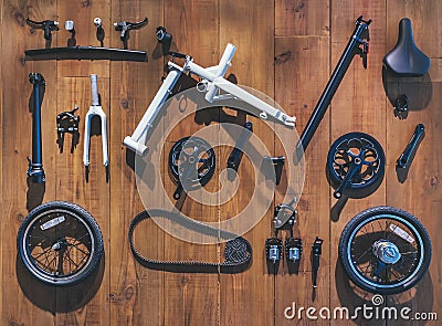 Bicycle parts lay on wooden wall background Flat lay equipment cycling tools Stock Photo