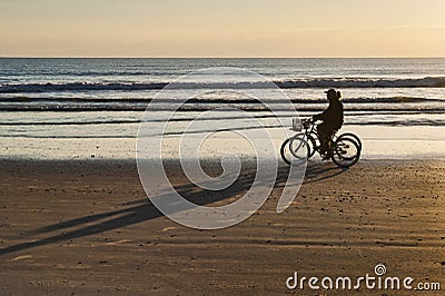 Bicycle Ride at Sunrise on Cocoa Beach Stock Photo