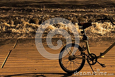 Bicycle on the seashore in sepia style Stock Photo