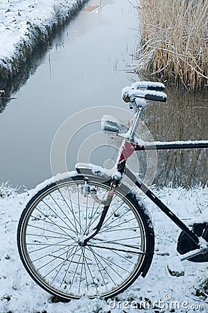 Bicycle in the snow Stock Photo