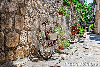 Bicycle on street in Perast Stock Photo