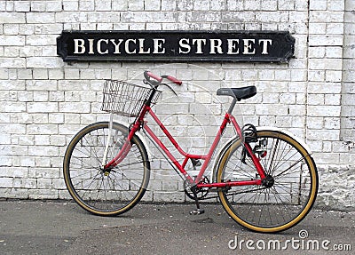 Bicycle Street Sign and Red Bike Stock Photo