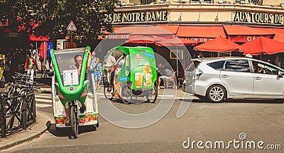 Bicycle taxis drivers wait for customers in front of a terrace Editorial Stock Photo