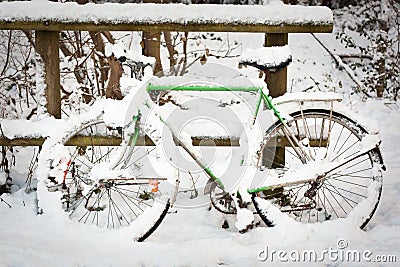 Bicycle under pack of snow Stock Photo