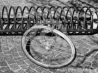 Bicycle wheel on a rack left from a stolen bike Stock Photo