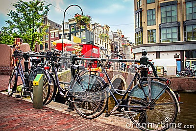 Bicycles on Amsterdam street on sunny summer day. Stock Photo