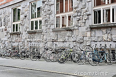 Bicycles Parked Next to Old Stone Building in Ljubljana, Slovenia Stock Photo