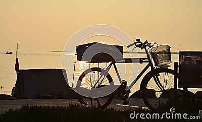 Bicycles at sunset on the beach tÃ¼rkiye Stock Photo