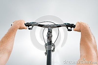 The bicyclist on gray, studio shot. Stock Photo
