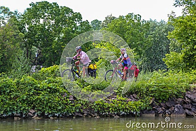 Bicyclists enjoy ride at the Erie Canal canal way trail in Upstate New York Editorial Stock Photo