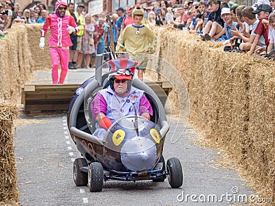 BIDEFORD, DEVON, ENGLAND - JUNE 18 2023: Participant in the annual Soapbox Derby fun race event in the town. Editorial Stock Photo