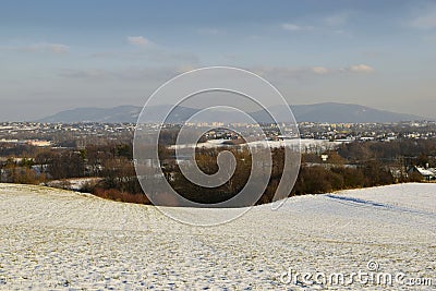 The Bielsko-BiaÅ‚a city against the backdrop of mountains in winter. Stock Photo