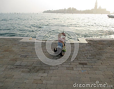 Biennial Venice 2017 artist painting in front of the sea Venice ItalynEurope Editorial Stock Photo