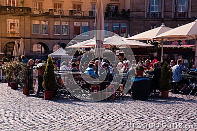 Biergarten at Altmarkt. People in a beer garden pub. Editorial Stock Photo