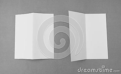 Bifold white template paper on gray background . Stock Photo