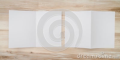 .Bifold white template paper on wood texture Stock Photo