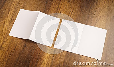 .Bifold white template paper on wood texture Stock Photo