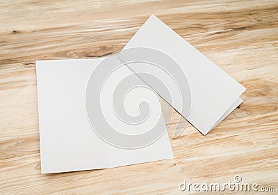 .Bifold white template paper on wood texture Stock Photo