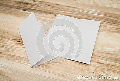 Bifold white template paper on wood texture. Stock Photo