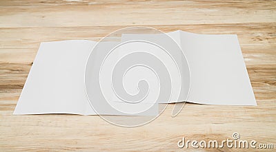 Bifold white template paper on wood texture. Stock Photo