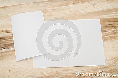 Bifold white template paper on wood Stock Photo