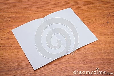 .Bifold white template paper on wood texture Stock Photo