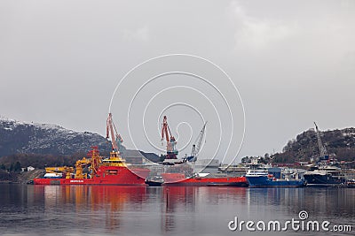 Big activity at Kleven Yard with one Maersk AHTS vessels, Edda Freya, one private yacht named Ulysses and two offshore supply Editorial Stock Photo