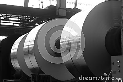 Big aluminum coils on heavy iron supports Stock Photo