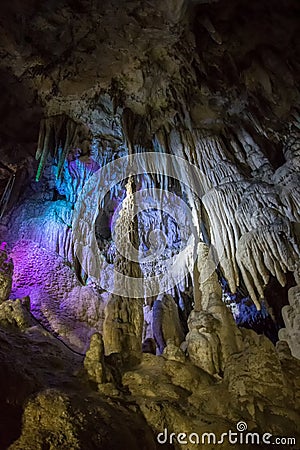 Big Azishskaya cave with speleothem, stalactites, stalagmites and stalagnates Stock Photo