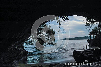 Big beach rock hole scene with blue sky Stock Photo