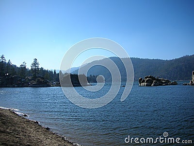Big bear lake, water, rocks and pine trees Stock Photo