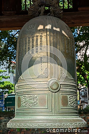 Big bell on side of Imperial Academy in Temple of Literature Van Mieu, the first national university in Hanoi Stock Photo