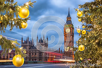 Big Ben with Christmas tree on bridge in the evening, London, England, United Kingdom Stock Photo